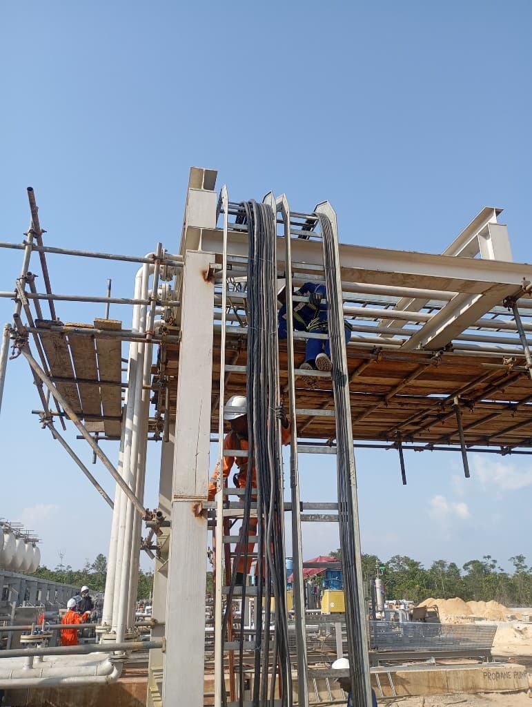 CHAAD Energy workers on industrial scaffolding at a processing facility